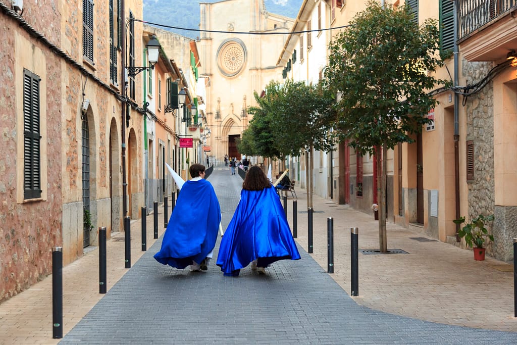 Children wearing traditional blue capes take part in Semana Santa in Esporles | The AgencyRE Mallorca