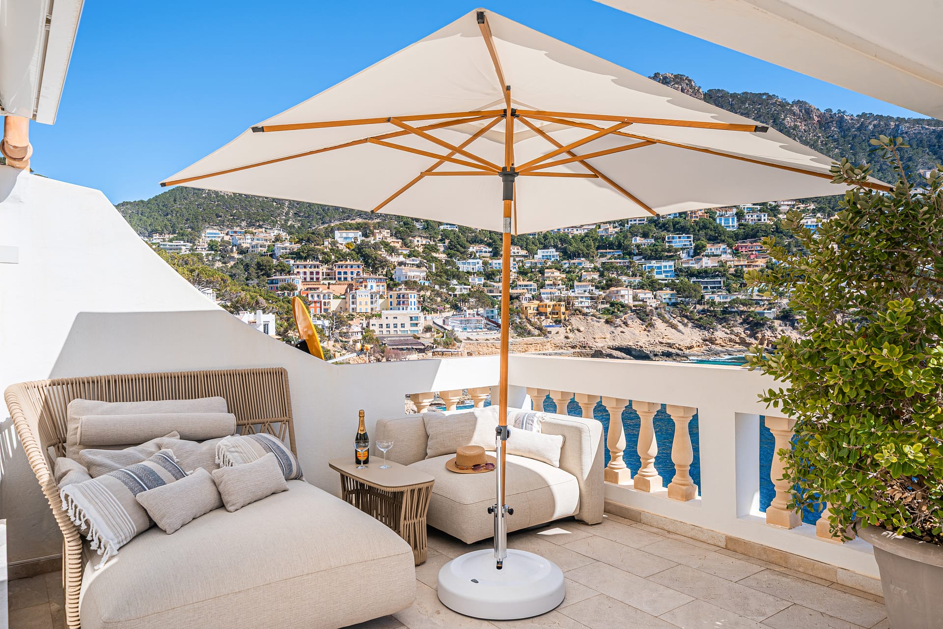 A sleek 130m² waterfront residence with 2 bedrooms, 2 bathrooms, and spectacular panoramic views over Cala Llamp.