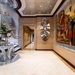 QUEEN-MAVIA_26_SW_Main-deck-foyer_Queen-Mavia-146_LR-YoGJp85r